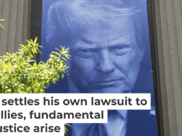 A banner featuring President Trump on the outside of the DOJ building in Washington, D.C. Andrew Harnik/Getty Images